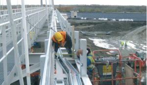 people working on a metal structure
