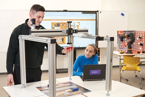 teacher with gantry with student observing