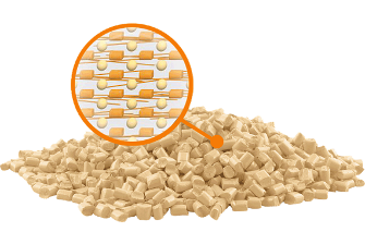 beige plastic granules with bubble showing solid lubricant within
