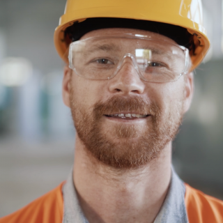 smiling engineer with hard hat