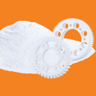 SLS powder and plastic gears in white on a background of igus orange