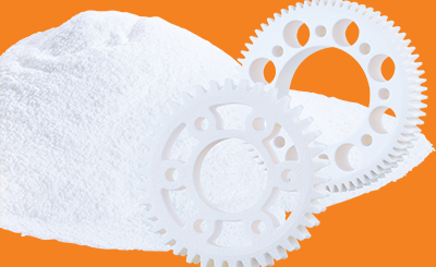 SLS powder and plastic gears in white on a background of igus orange
