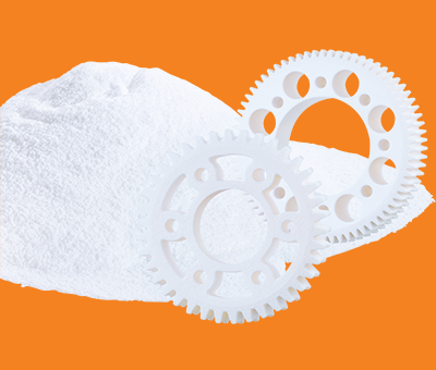 SLS powder and plastic gears in white on a background of igus orange