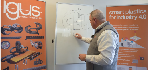 person at whiteboard writing about different cable carrier measurements for replacing e-chains