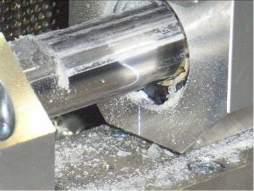 close-up of a linear system in a machine that has sugar or salt on it