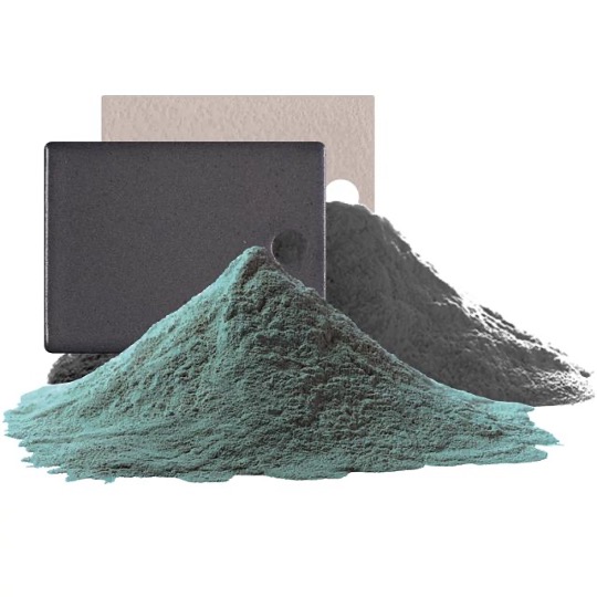 powder-coated metal plates, two piles of coating powder, one turquoise, the other grey