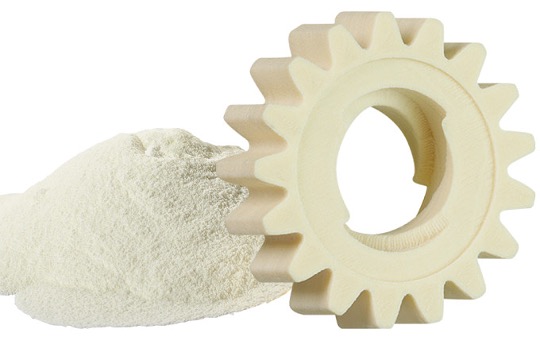 off-white 3d-printed plastic gear next to wear-resistant sls powder