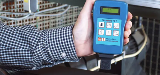 man holding belt tension meter